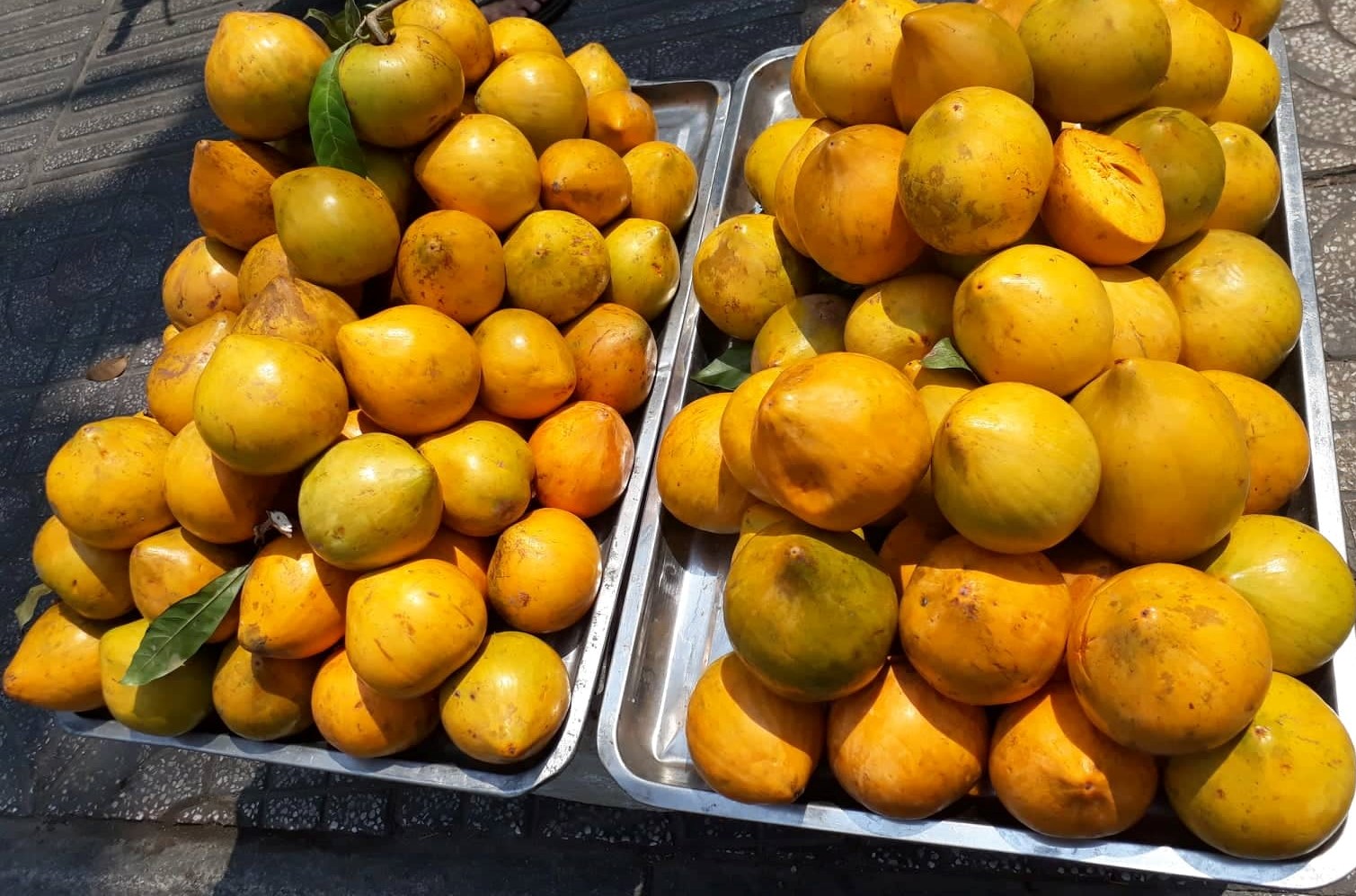 Lucuma eggfruits sold on a street in Vietnam