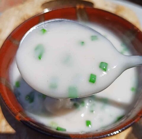 coconut milk with chopped scallions